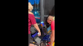 Prankster defuses tension with a giant inflatable phone, leaving everyone smiling