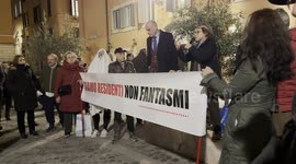 A protester dressed as ghost behind the banner with the slogan ‘we are residents not ghosts’ displayed during the speeches during the protest against the unlivability of some areas of the historic center, due to mass tourism, in Rome.