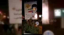 Iran: Iranian Protestor Sets Fire to Supreme Leader's Banner in Tehran