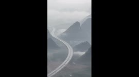 Expressway passes through ink wash painting created by nature