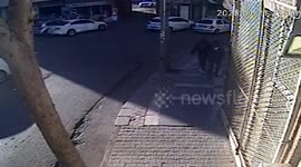 Out-of-control car crashes into father and young son walking on pavement