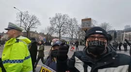 Demonstrators against Chinese Embassy plans at Royal Mint Court cause chaos by walking aimlessly with placards