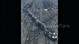 Huge freight trains in China navigate winding tracks resembling retro 'Snake' phone game