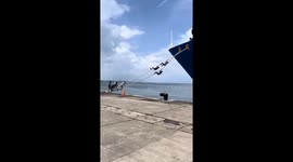 Hawkers shimmy along ship ropes like marines as they board vessel to sell their wares