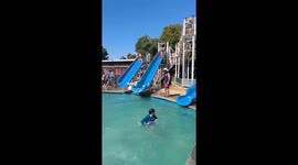 Woman speeds down waterslide and crashes into boy in pool