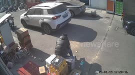 Unexpected twist: Delivery mishap sends phone under car wheel