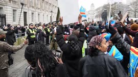 Congolese protest held at Whitehall, London. Several interviews and shots of protesters chanting and blocking the road