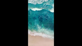 Aerial Serenity Over Bali – Mesmerizing Waves and the Endless Ocean