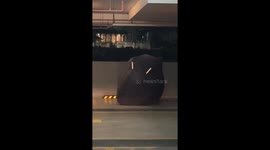 Motorcycle cover shakes like a ghost in dark car park