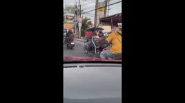 Woman 'works from home' while using laptop on a tuktuk