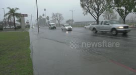 US, Los Angeles: San Bernardino Street Flooding and Big Rig Over The Side Due To Rain