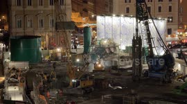 Workers at work in the evening at the construction site of the new Piazza Venezia stop on the Metro C in Rome.