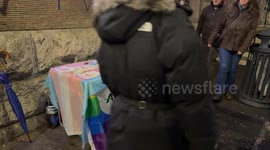 The information stand of Arcigay Roma on which the rainbow flag has been laid out where the Baci Perugina are placed and which are distributed to passers-by on the occasion of the initiative ‘The Same Kiss’ organized by Gay Center with Arcigay on Valentin