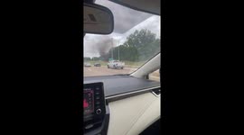 Car burning in flames and billowing smoke on Exit 26 just outside downtown Memphis, TN