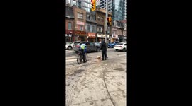 Man sets his shoes on fire on Yonge St in Toronto