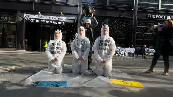 Extinction Rebellion activists protest outside the Post Building in London, targeting McKinsey & Company over its role in climate policies.