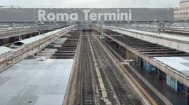 Empty platforms and the writing Roma Termini in the background on a day when the arrival board shows heavy delays of up to more than 3 hours at Termini Station in Rome.