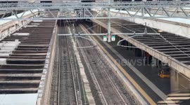 Empty platforms on a day when the arrival board shows heavy delays of up to more than 3 hours at Termini Station in Rome.