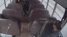 Bus driver hit by metal bar that smashes through window
