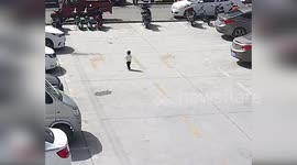 China: Driver Runs Over Young Child in Parking Lot