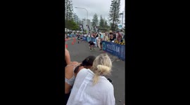 Aussie man does a ‘Shoey’ infront of screaming crowd mid triathlon!