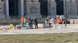 Workers at work on the construction site for the redevelopment of the square in front of the Basilica of St. John Lateran on the occasion of the Jubilee in Rome.