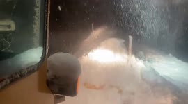 Snow blower negotiates blizzards in New York