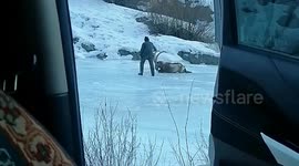 Brave herder rescues goat stranded on icy surface in China
