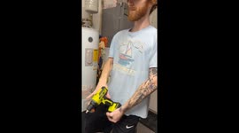 Guy Plays With Drill, Turns It To STRONG Setting Which Twists His Arm AND Falls Over Fail Funny