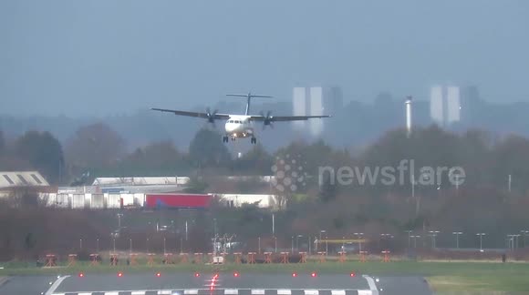 Pilots battle to land at Birmingham Airport during 50mph crosswinds as the UK is hit by weather warnings