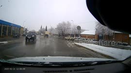 Sudden brake sees snow slide from car's roof onto front windscreen, motorist forced to get out and clear it