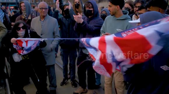 Union flag ripped in half by counter protesters. In Manchester last Saturday. As UKIP hold 
