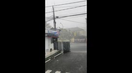 Locals filming rain given fright of their lives as lightning strikes just metres away