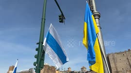 The Russian and Ukrainian flag during the sit-in to demonstrate against the “Putin regime” and to promote the “Energy For Life” campaign by some Russian dissidents in Rome.