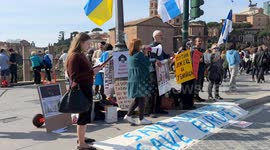 A protester shouts the slogan 'stop Putin, stop the war' with a megaphone (in Italian and Russian) during the sit-in to demonstrate against the “Putin regime” and to promote the “Energy For Life” campaign by some Russian dissidents in Rome.