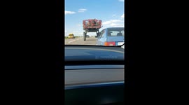 Car Drives Under Tractor