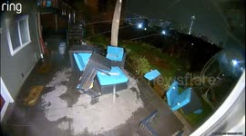 Strong Wind Gusts Cause Outdoor Furniture to Scatter in Seattle Yard, Captured on Camera