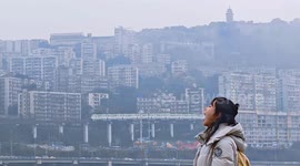 Woman playfully pretends to eat a train in Shaanxi, China