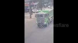 Elderly man in wheelchair pushed along by truck in China saved by quick-thinking biker