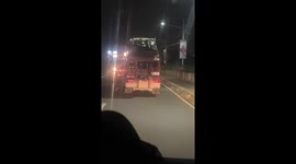 Man caught sleeping with feet outside in jeep in Manila, Philippines