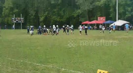 Heartwarming moment American football teams unite to allow wheelchair-bound player to score