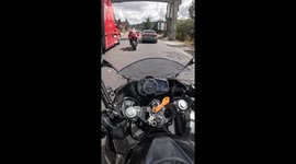 Motorcyclist avoids collision with speeding car in El Tejar, Guatemala