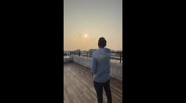 Flock of pigeons swarms terrace for food in Delhi, India