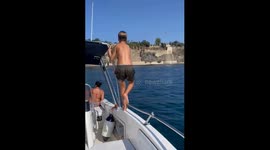 Boy slips and falls inside a boat in Procida, Italy