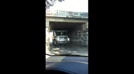 Guy stuck under bridge