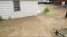 Gushing floodwater engulfs West Virginia homes, USA