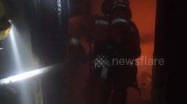 Firefighter rescues 30 people including pregnant woman from burning hotel in china