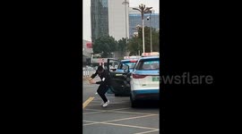 Chinese taxi driver performs flips whilst waiting for passengers