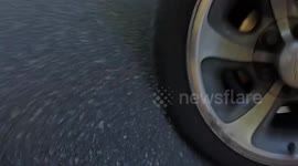 Motorcycle Vlogger Crashes After Attempt to Throw Business Cards