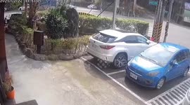 Car plunges into sinkhole outside shops in Taiwan